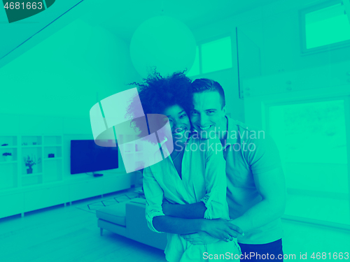 Image of multiethnic couple hugging