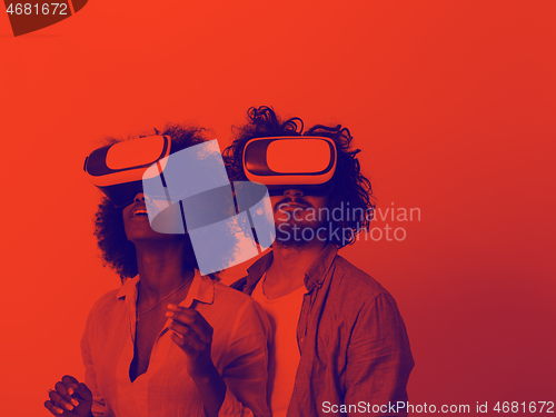 Image of multiethnic couple getting experience using VR headset glasses