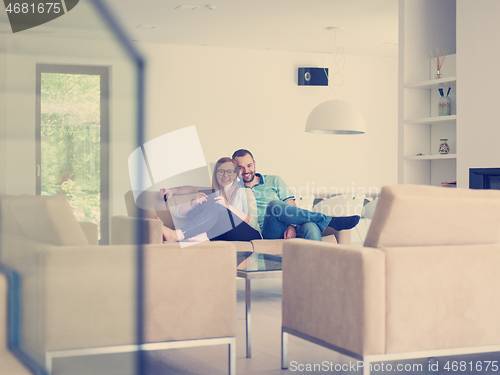 Image of couple relaxes in the living room