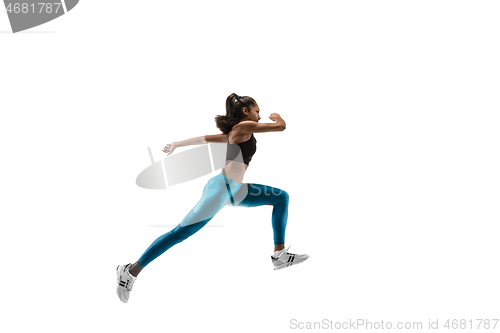 Image of Young african woman running or jogging isolated on white studio background.