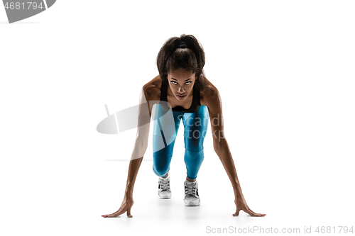 Image of Young african woman running or jogging isolated on white studio background.