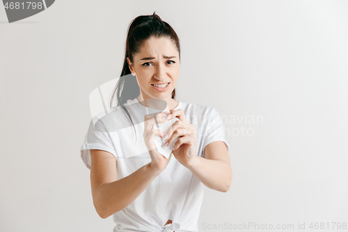 Image of Young woman with a sad expression lost a bet