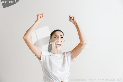 Image of Winning success woman happy ecstatic celebrating being a winner.