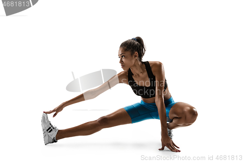 Image of Young african woman isolated on white studio background.