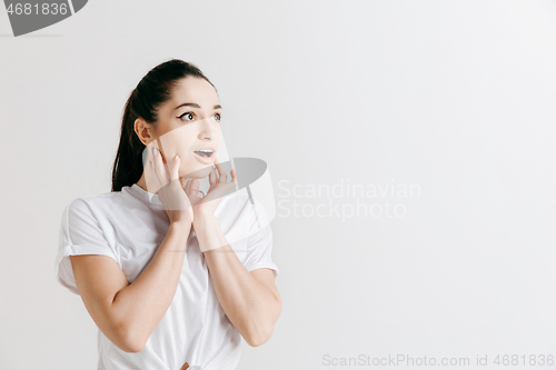 Image of Beautiful woman looking suprised