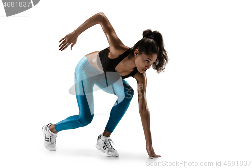 Image of Young african woman running or jogging isolated on white studio background.