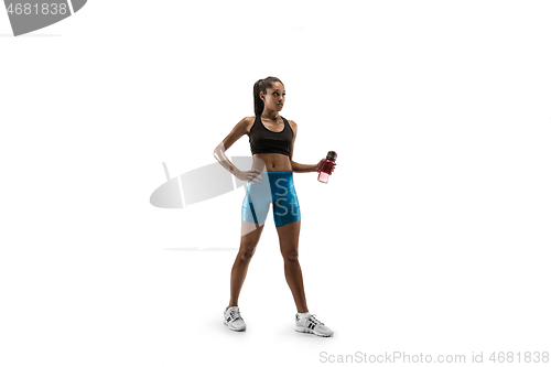 Image of Young african woman isolated on white studio background.