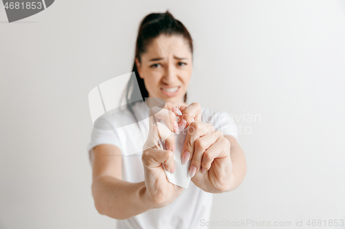 Image of Young woman with a sad expression lost a bet