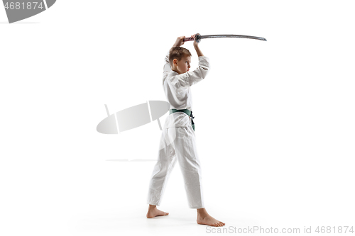 Image of Teen boy fighting at aikido training in martial arts school