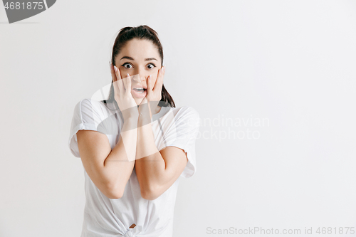 Image of Beautiful woman looking suprised