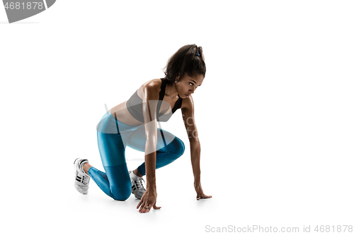 Image of Young african woman running or jogging isolated on white studio background.