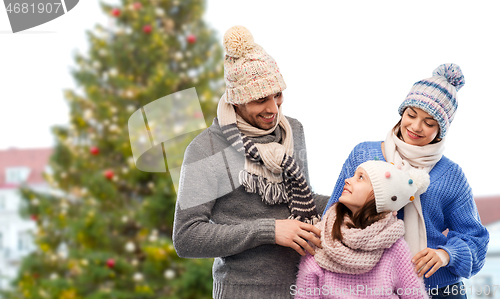 Image of happy family over christmas tree in tallinn
