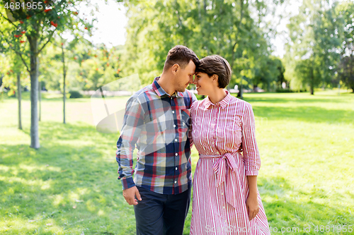 Image of happy couple in summer park