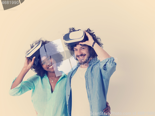 Image of multiethnic couple getting experience using VR headset glasses