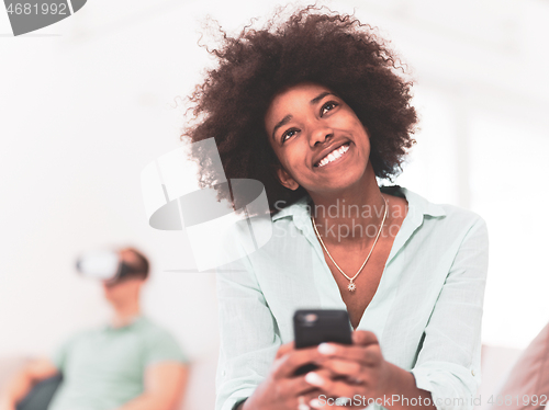 Image of Multiethnic Couple using virtual reality headset