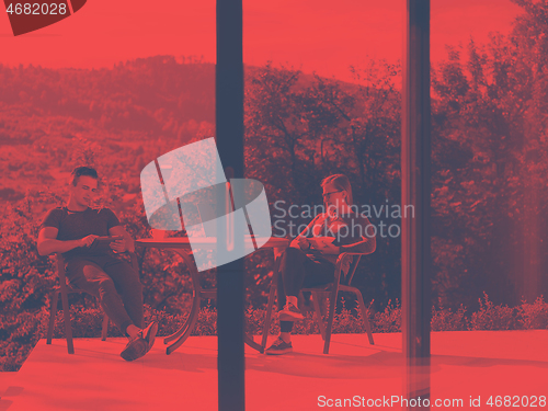 Image of couple enjoying morning coffee and breakfast