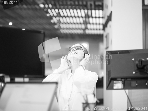 Image of businesswoman using a laptop in startup office