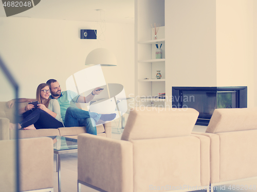 Image of couple relaxes in the living room