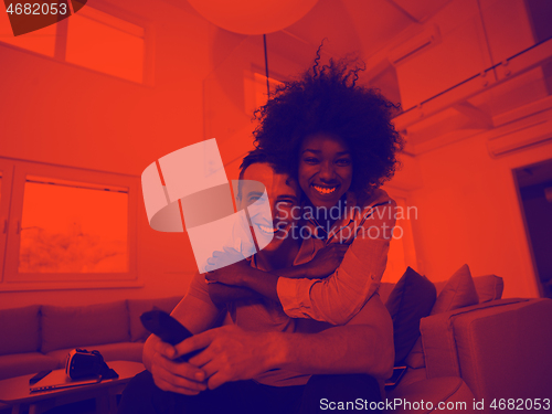 Image of multiethnic couple hugging