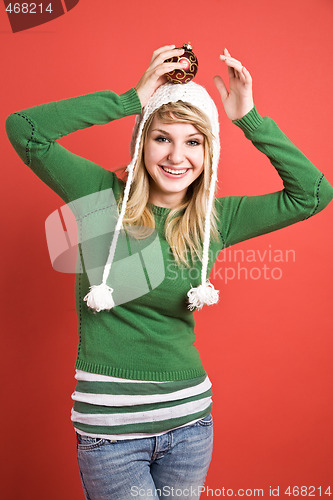 Image of Caucasian girl with christmas ornament