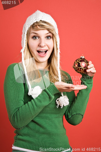 Image of Caucasian girl with christmas ornament