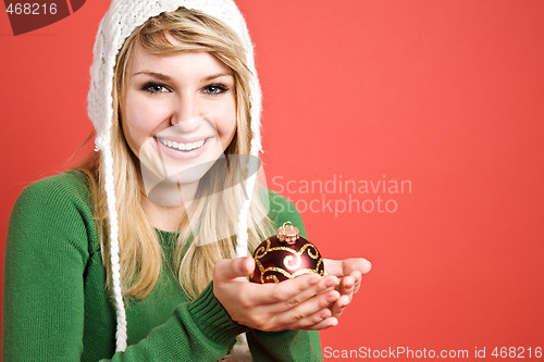Image of Beautiful caucasian girl with christmas ornament