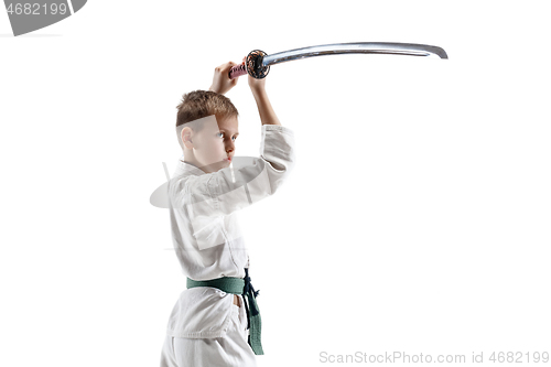 Image of Teen boy fighting at aikido training in martial arts school