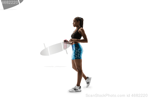 Image of Young african woman isolated on white studio background.