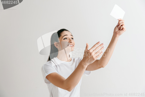 Image of Young woman with a surprised expression won a bet