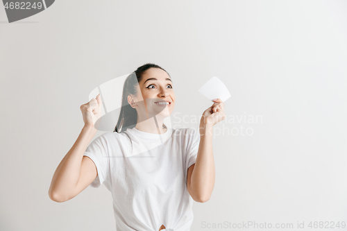 Image of Young woman with a surprised expression won a bet