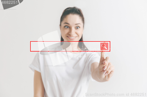 Image of Woman\'s hand with finger on gray background