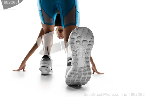 Image of Young african woman running or jogging isolated on white studio background.