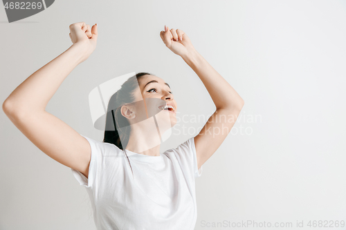 Image of Winning success woman happy ecstatic celebrating being a winner.