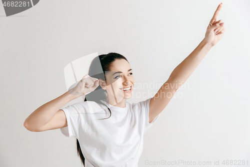 Image of Winning success woman happy ecstatic celebrating being a winner.