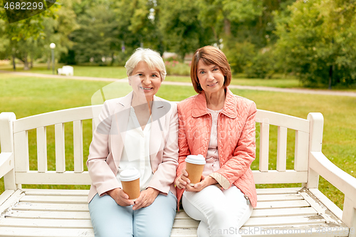 Image of senior women or friends drinking coffee at park