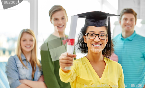 Image of graduate student girl in mortar board with diploma