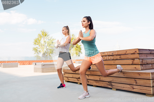 Image of women training and doing split squats