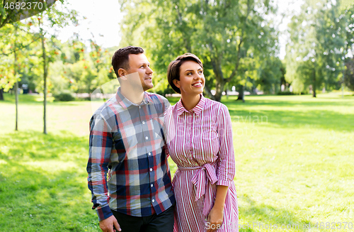Image of happy couple in summer park
