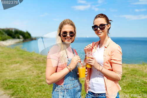 Image of teenage girls or friends with drinks in summer