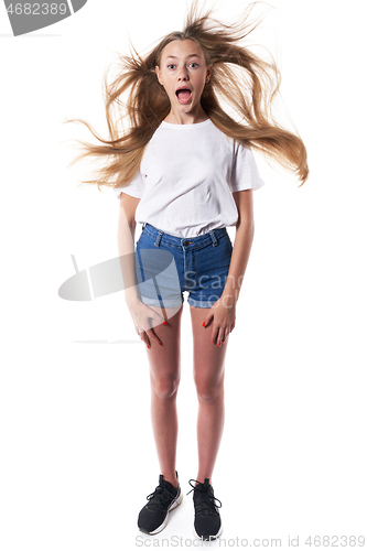 Image of Shocked teen standing over white background shouting