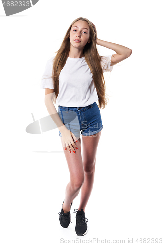 Image of Full length of casual teen girl posing over white background