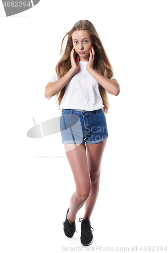 Image of Full length of casual teen girl posing over white background