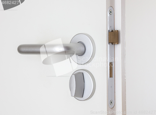 Image of White door with chrome doorhandle