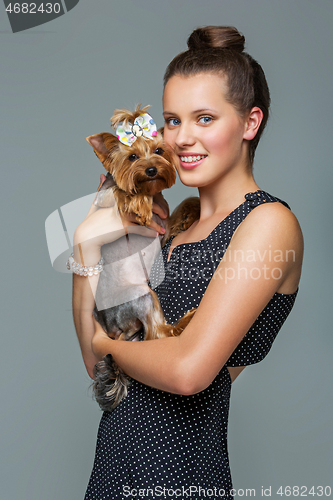 Image of Girl with yorkie dog