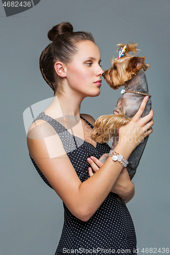 Image of Girl with yorkie dog