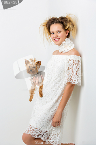 Image of Girl with yorkie dog