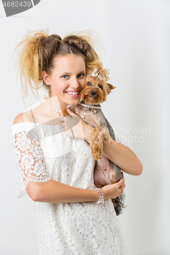 Image of Girl with yorkie dog