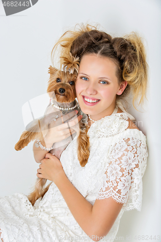 Image of Girl with yorkie dog