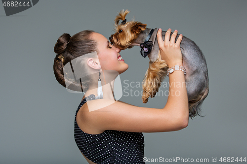 Image of Girl with yorkie dog