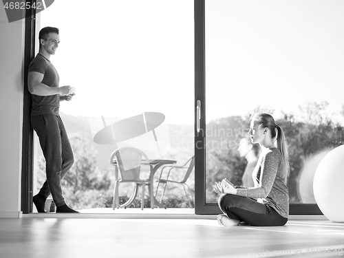 Image of couple on the door of their luxury home